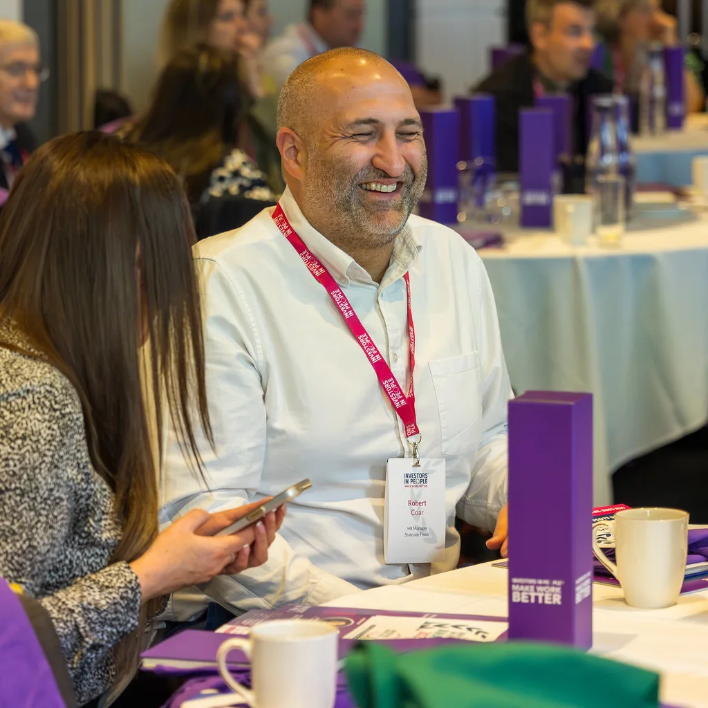 Delegates in conversation at an Investors in People event